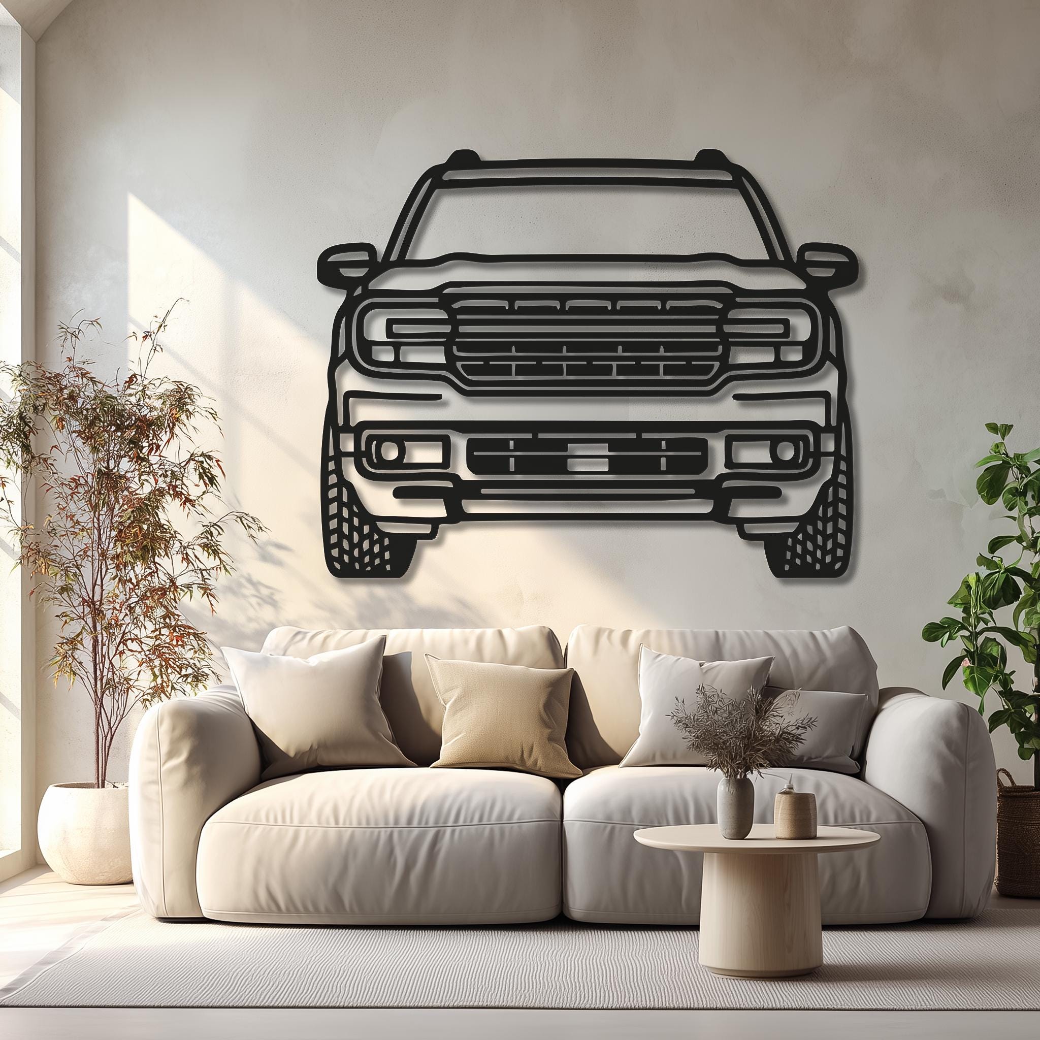 Living-room scene with large pickup truck metal wall art above sofa. Matte-black CNC outline, custom from photo, ready to hang. Ideal for truck lovers and gifts.
