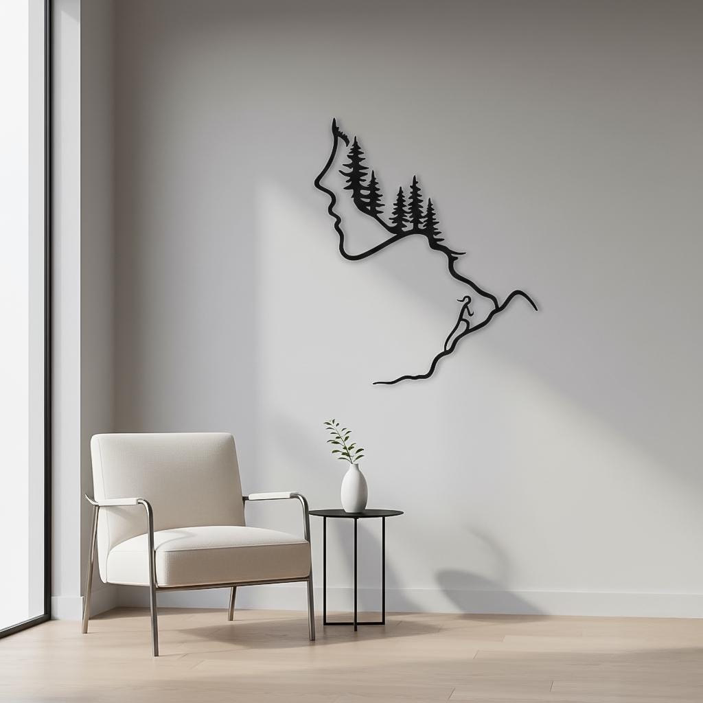 Minimal black metal mountain and forest line art with woman’s face and hiker, installed on a clean light wall next to a modern white armchair and small table. Minimalist hiking metal wall art, Scandinavian mountain climber decor, forest silhouette sculpture for calm interiors.