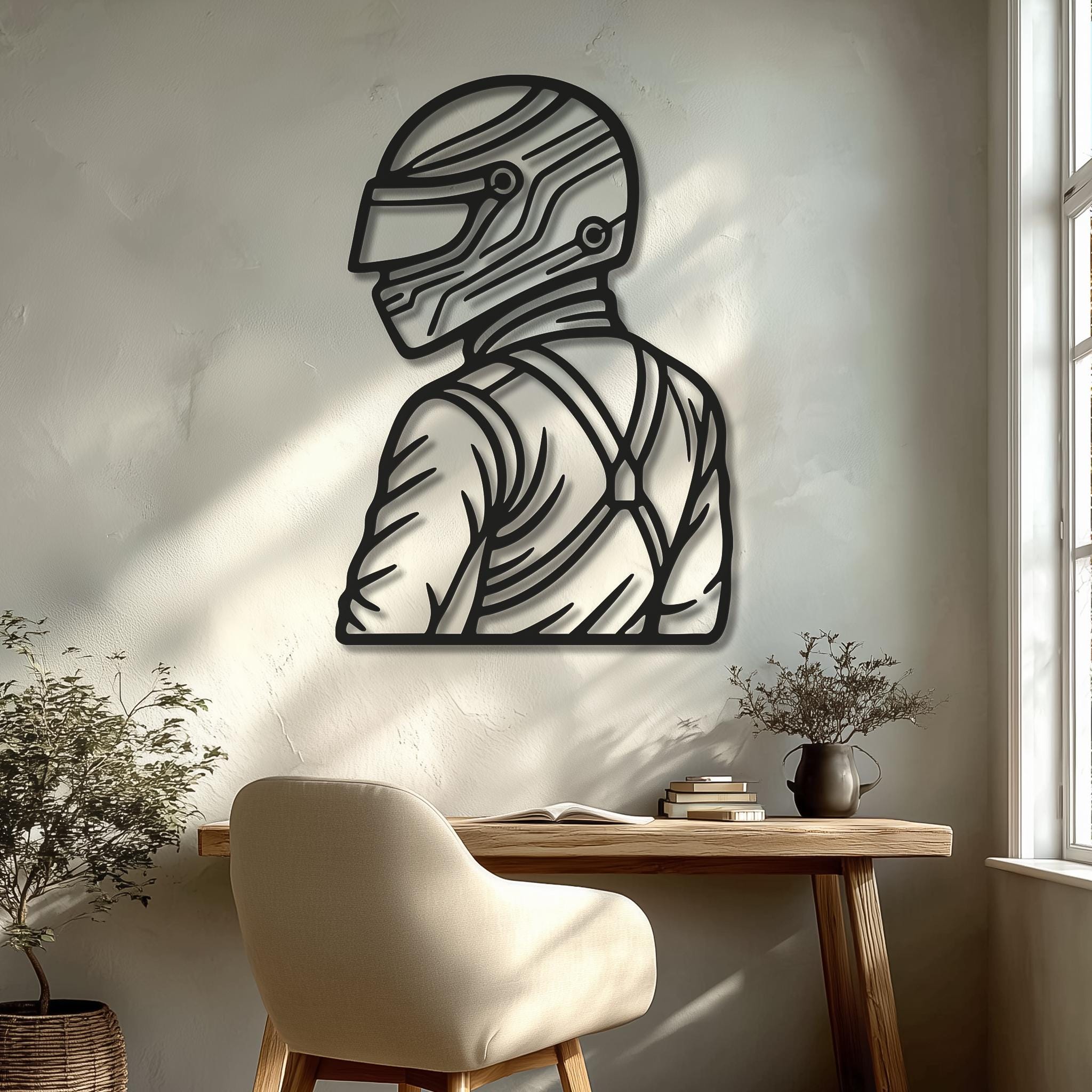 Motorsports driver helmet silhouette, matte-black CNC metal, on a warm home-office wall near a window; sleek racing-inspired decor; great gift for motorsport fans; multiple sizes; minimal and modern look; easy mounting hardware included.