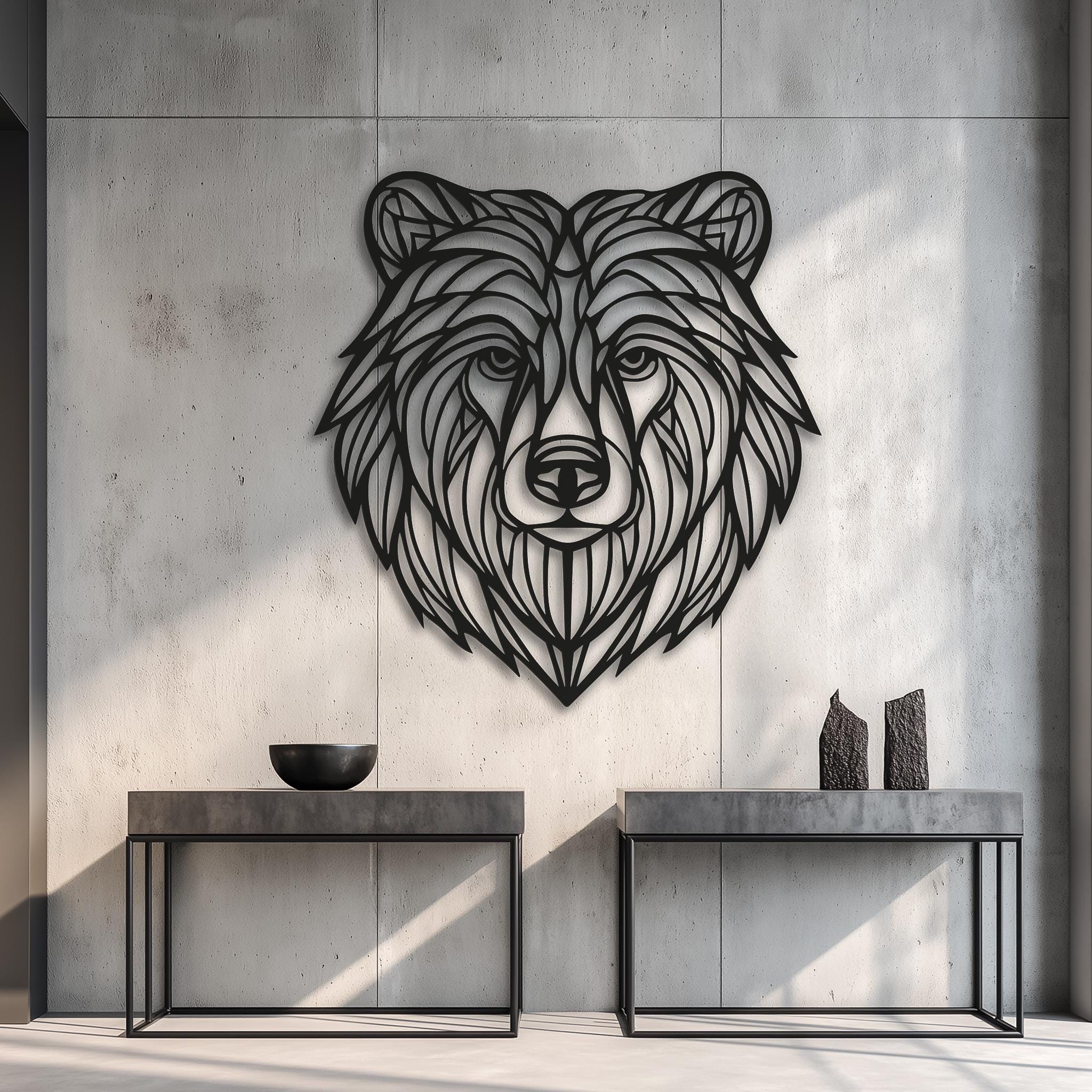 Gallery-style concrete wall featuring a large CNC laser-cut bear head metal wall art; black powder-coated line art sculpture; minimalist industrial home decor, handmade animal wall piece.
