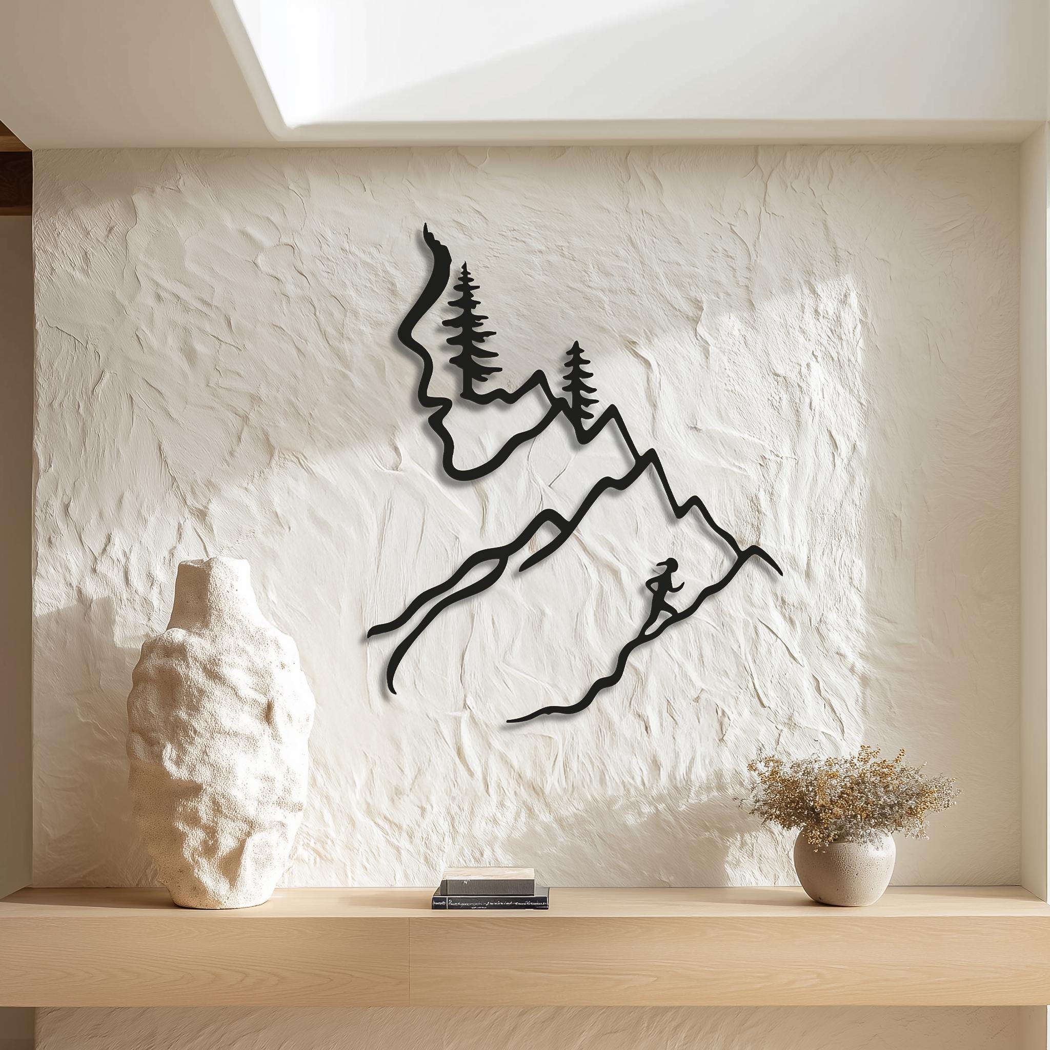 Minimal mountain wall art with woman runner silhouette and pine trees on textured niche wall, modern line art running wall decor and outdoor lover gift.