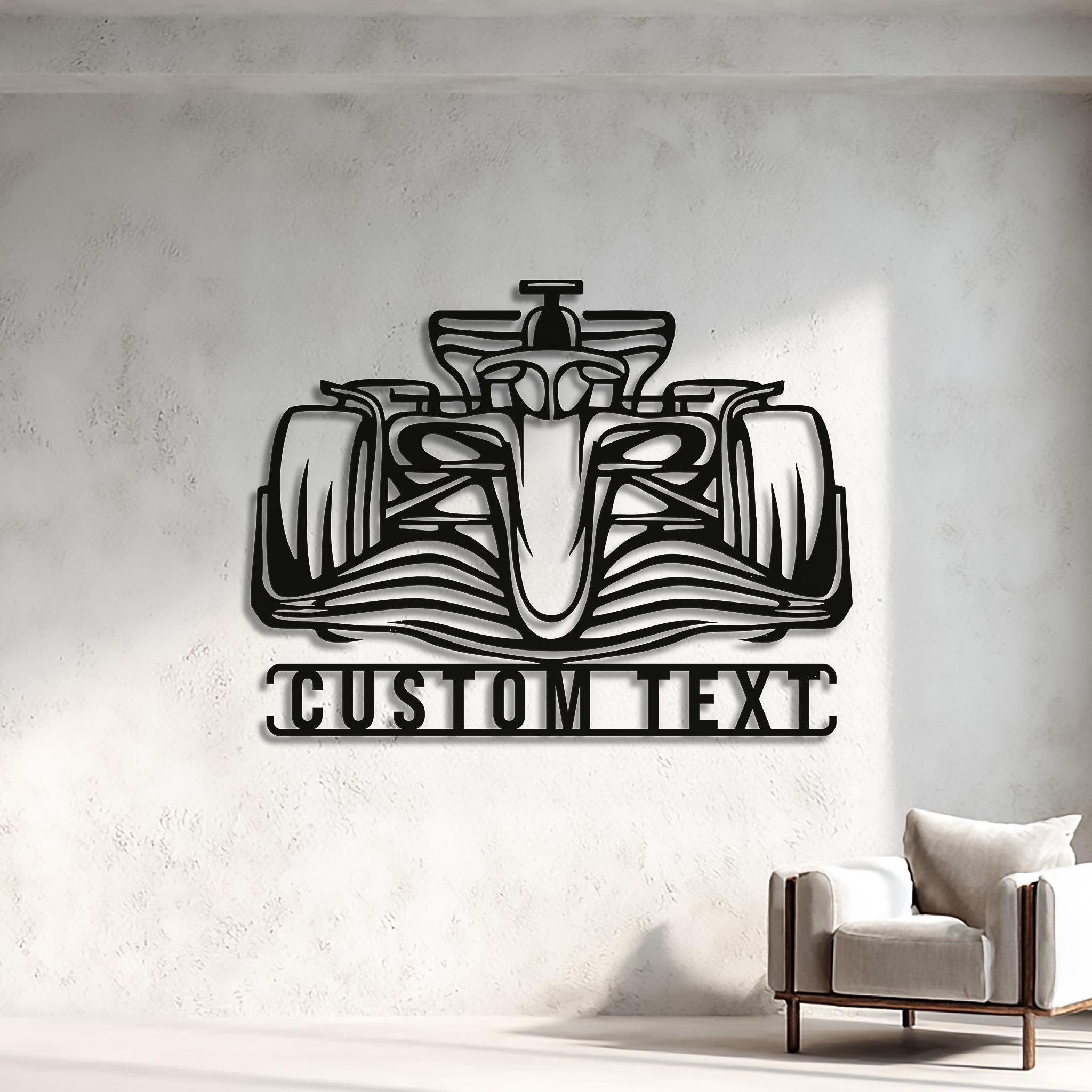 Open-wheel racing car metal wall art with customizable nameplate (CUSTOM TEXT) in powder-coated matte black. Laser-cut steel with 3D shadow effect on light wall; ideal for living room, office, or garage décor. Personalized motorsport gift for car enthusiasts; modern racing-style wall sculpture.