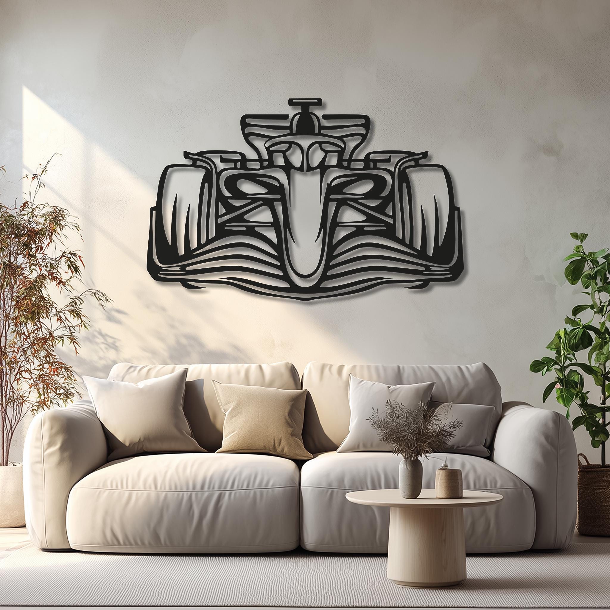 May include: A black metal Formula 1 race car wall art. The artwork is a detailed outline of a race car, mounted on a neutral-colored wall above a sofa. The car's design includes tires, a cockpit, and aerodynamic features.