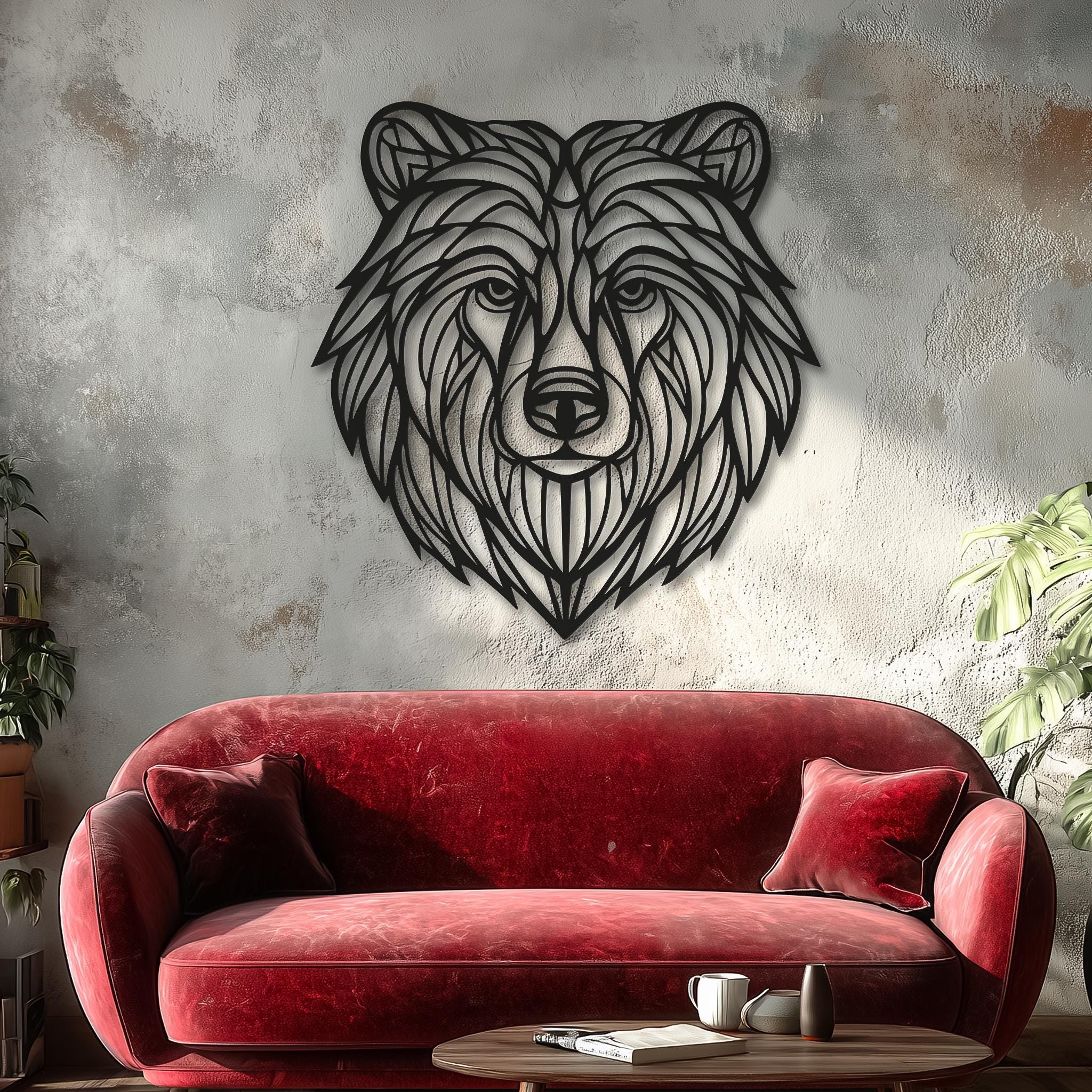 Large grizzly bear head metal wall art, CNC laser-cut black steel above a red velvet sofa on textured light wall; Scandinavian/industrial living room decor, lodge gift, handmade powder-coated sculpture.