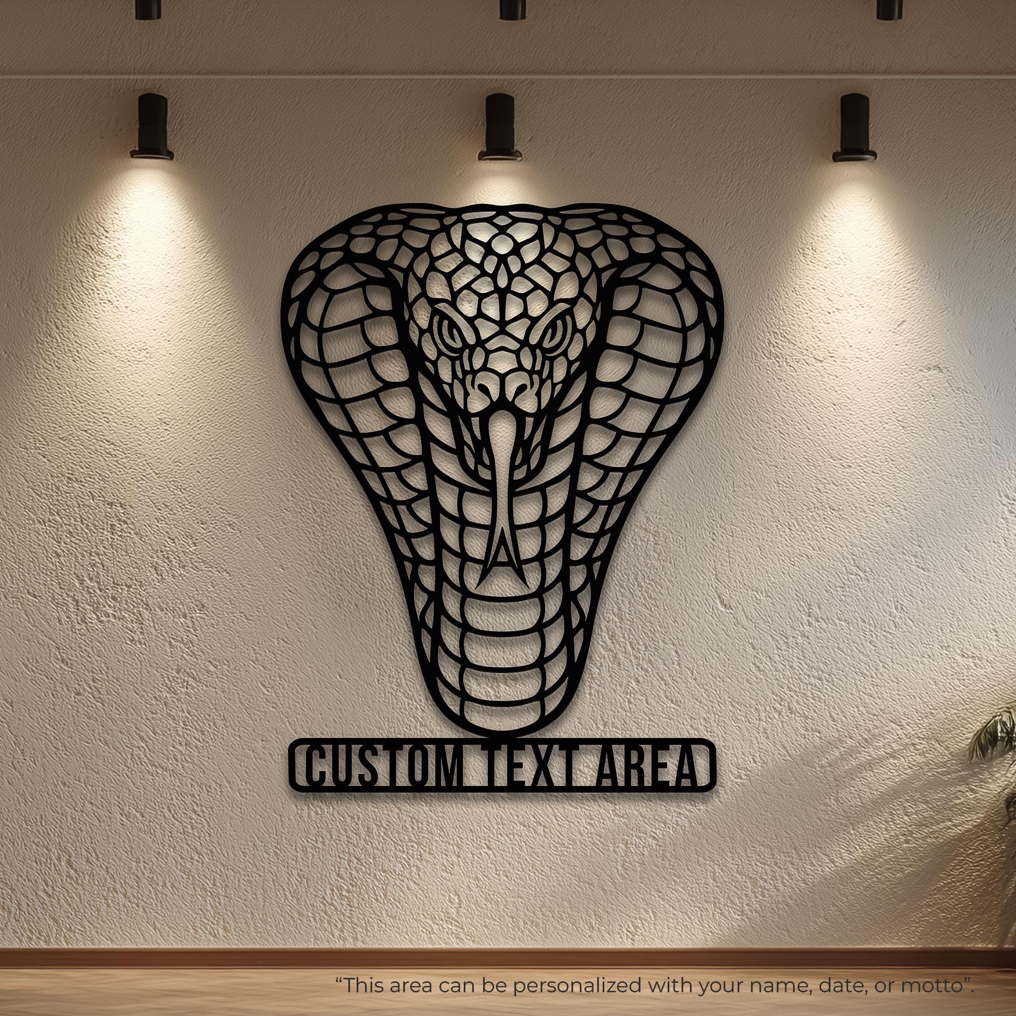 Personalized cobra metal wall art with name bar; black powder-coated laser-cut steel; spotlighted gallery wall; custom text option for family name, motto or date; unique gift, entryway sign, man cave decor; large modern wall sculpture