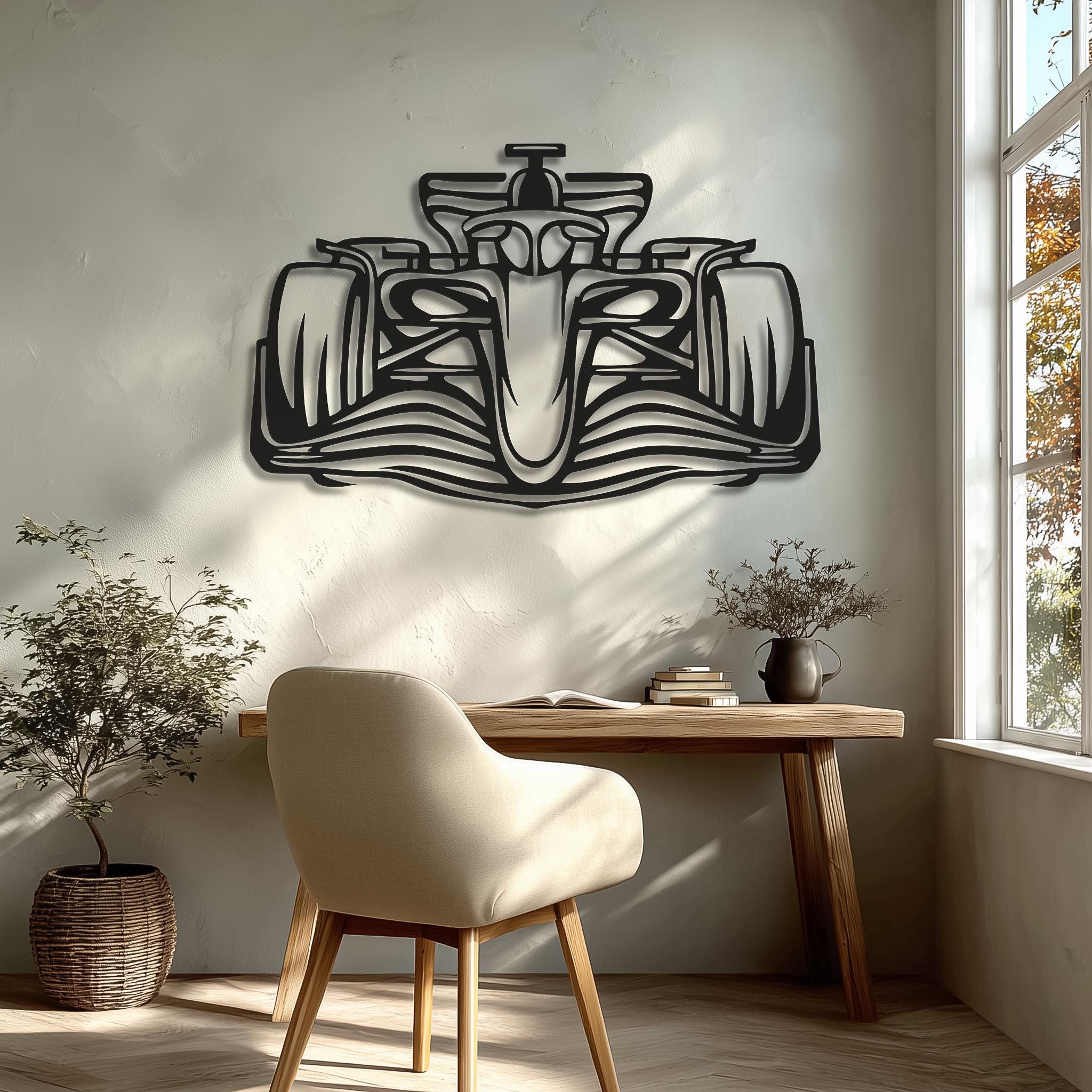 May include: Black metal Formula 1 race car wall art. The artwork depicts a detailed silhouette of a race car, showcasing its aerodynamic design. The piece is mounted on a neutral-colored wall, adding a modern touch to the space.