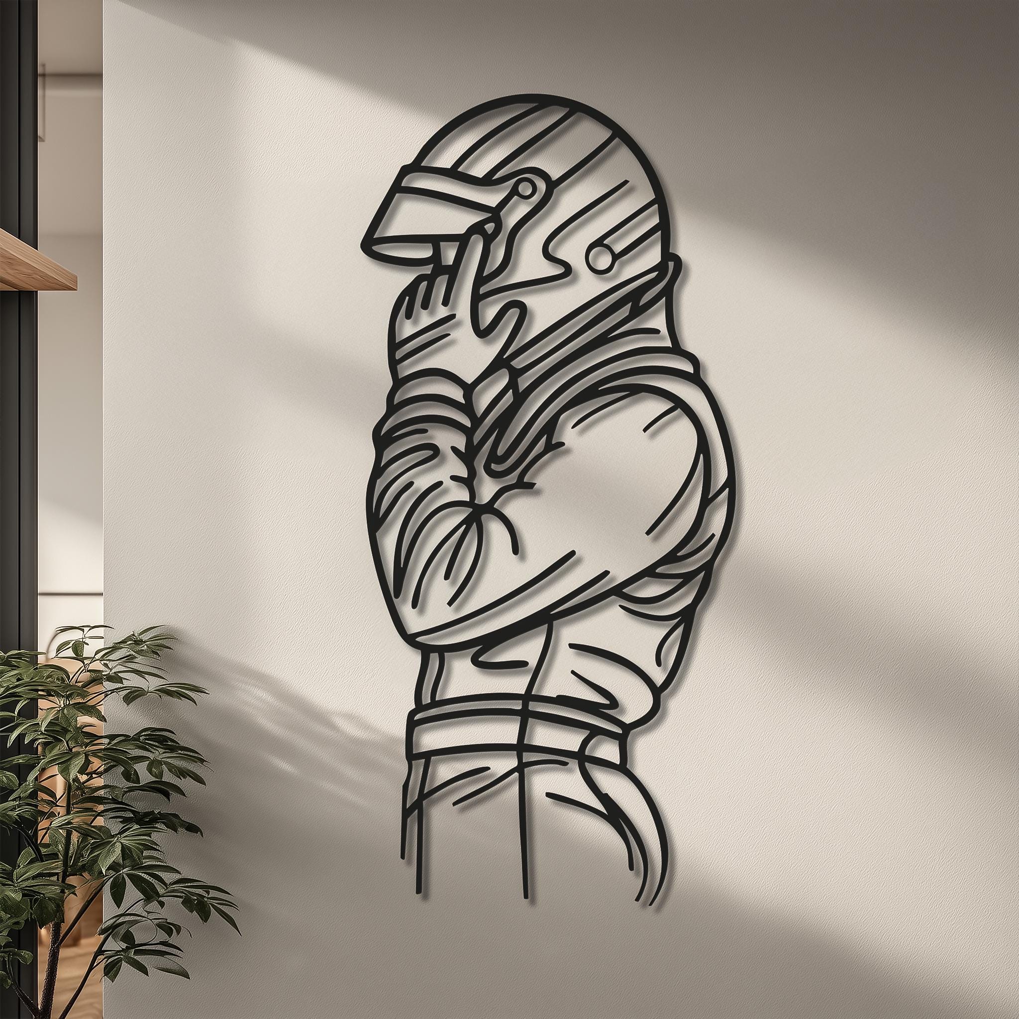Racer silhouette metal wall art in a hallway scene with soft daylight. CNC laser-cut, matte black. Personalize the sleeve with a name or race number. Great motorsports gift; multiple sizes; ready to hang.