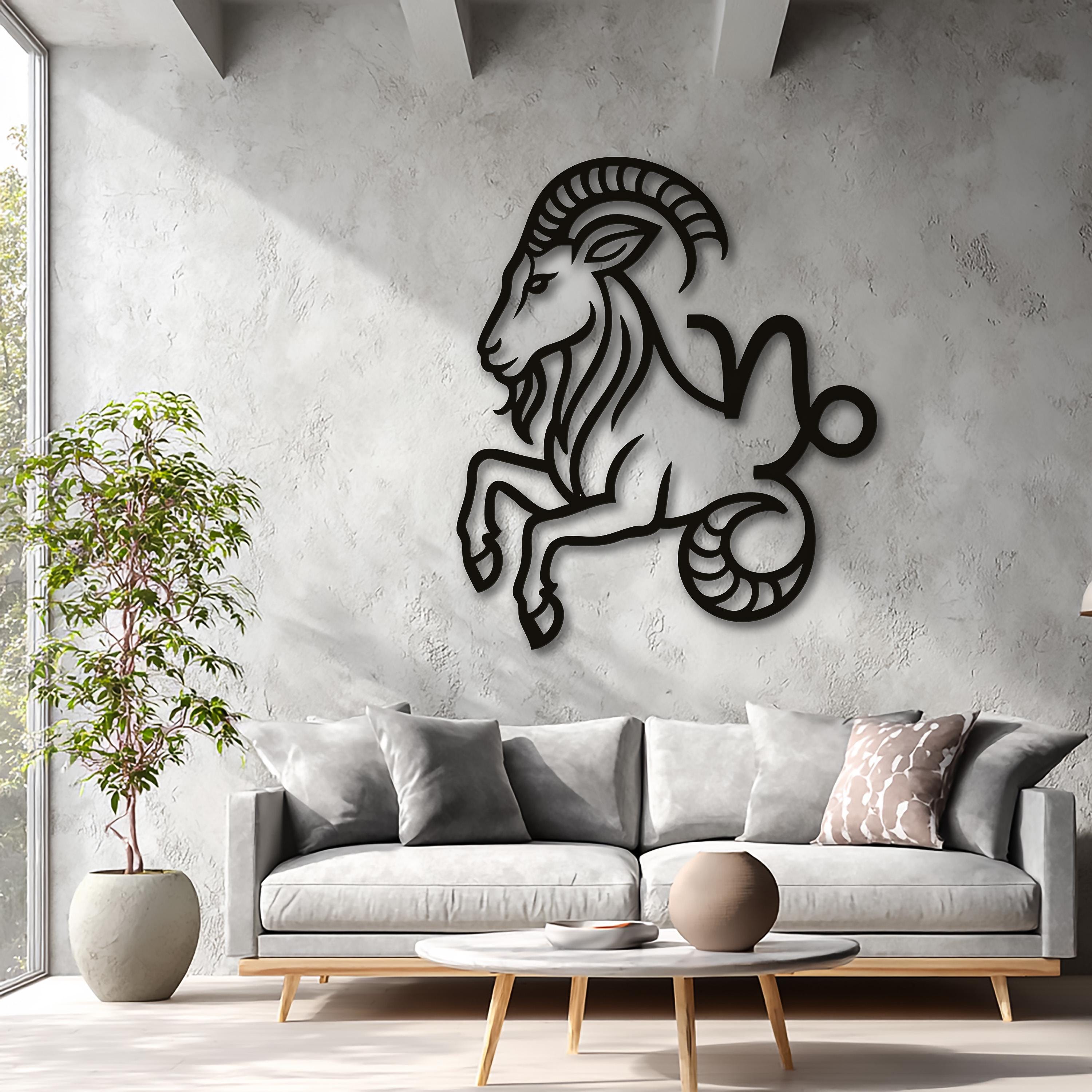 Large Capricorn zodiac CNC laser-cut black metal wall sculpture in an industrial loft interior, bold minimalist wall decor.