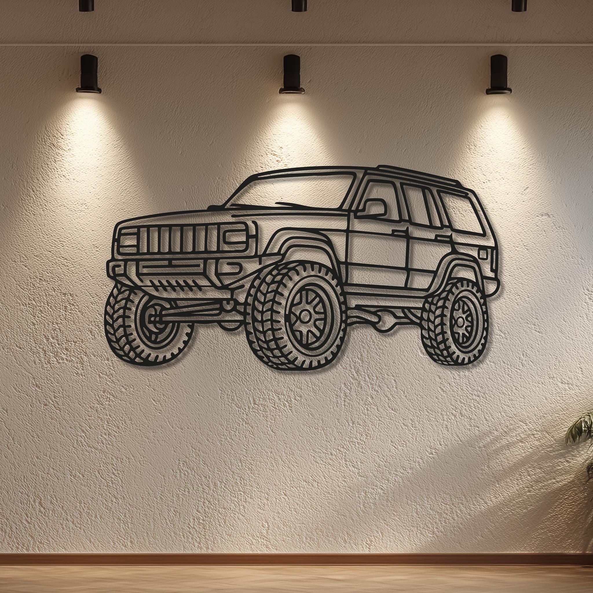 Off-road Jeep-style line-art wall sculpture under spotlights; matte black powder-coated metal; rugged 4x4 garage decor; custom vehicle metal art with optional name/plate; 3D standoff shadow adds depth; premium automotive wall decor.