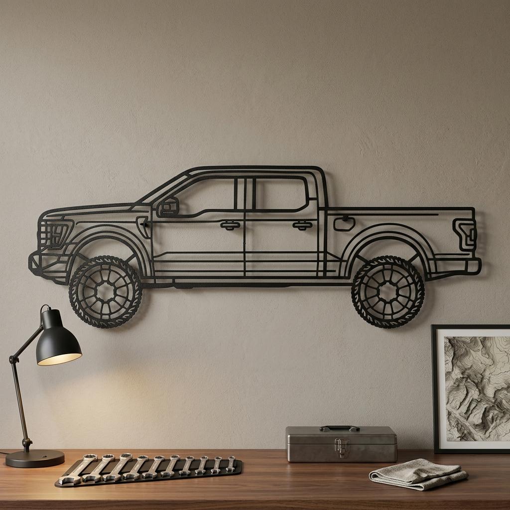 May include: A black metal wall art piece shaped like the side profile of a pickup truck. The design features a detailed outline of the vehicle body, including the cab, truck bed, and two circular wheels with a spoke pattern, all in a flat black finish.