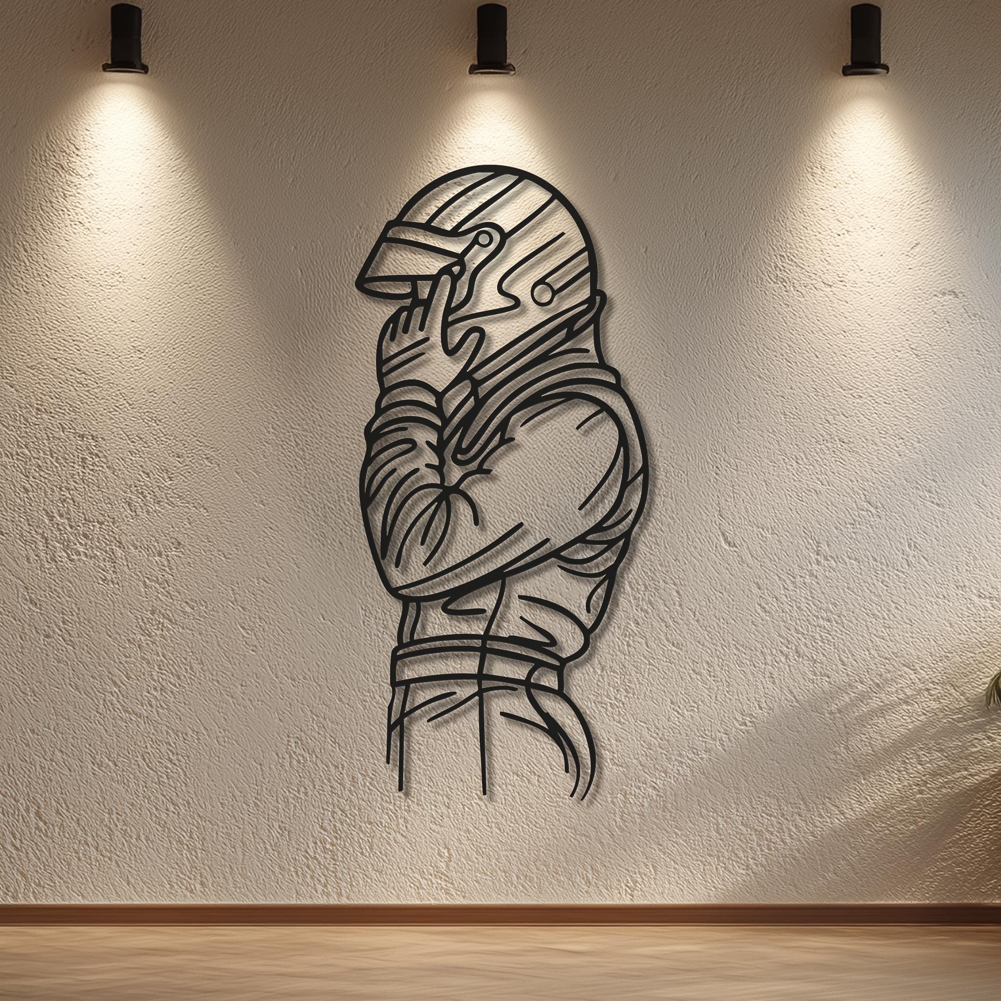 Motorsports driver profile metal wall art under ceiling spotlights; CNC laser-cut matte black lines. Personalizable sleeve (name/number/team). Gallery-style wall; modern décor; multiple sizes; ready to hang.