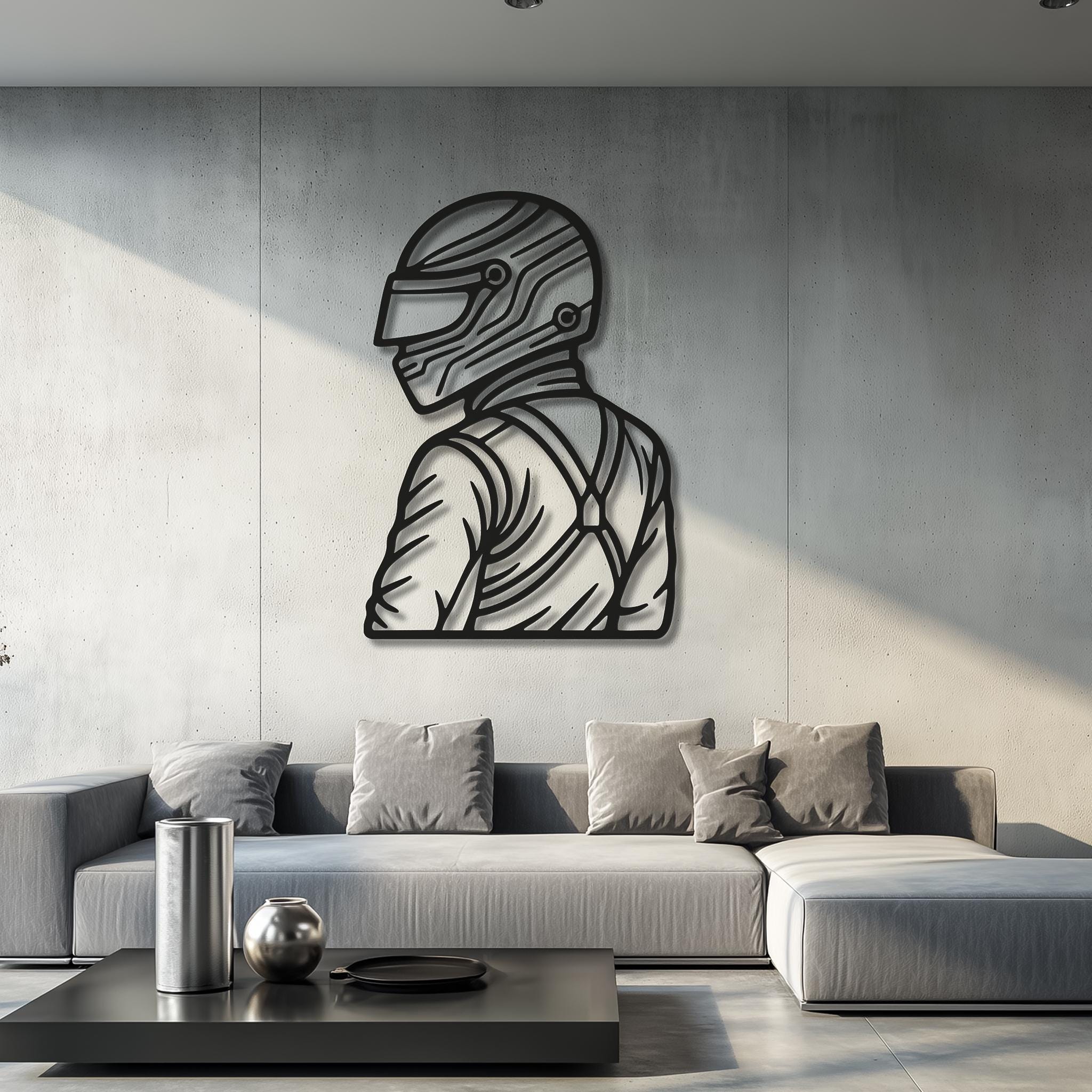 Motorsports driver helmet silhouette in matte-black CNC metal on a modern concrete living room wall; bold clean lines; racing theme decor; multiple sizes; simple mounting; premium powder-coated finish; ideal gift for motorsport enthusiasts and gamers.