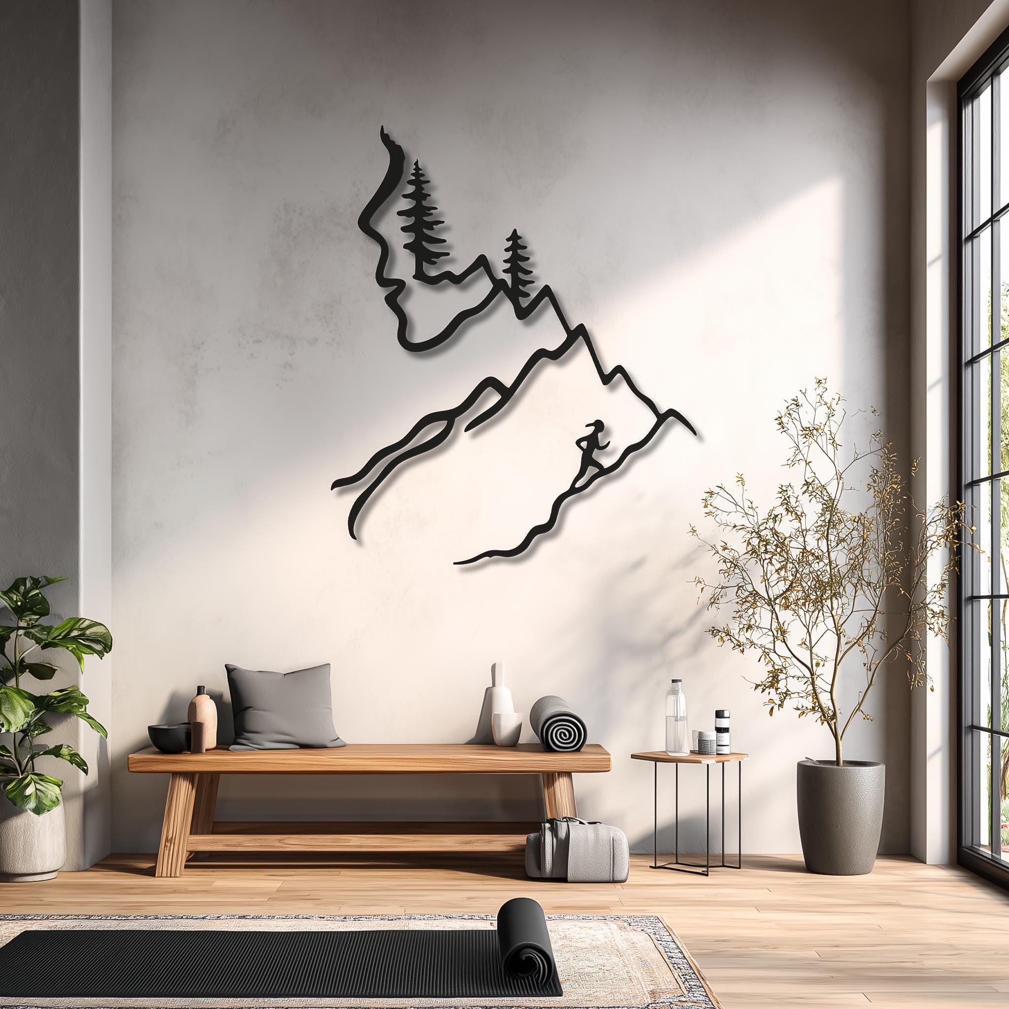 Female trail runner metal wall art of mountains and trees on home gym wall with yoga mat and bench, motivational art and sports wall art for runners.