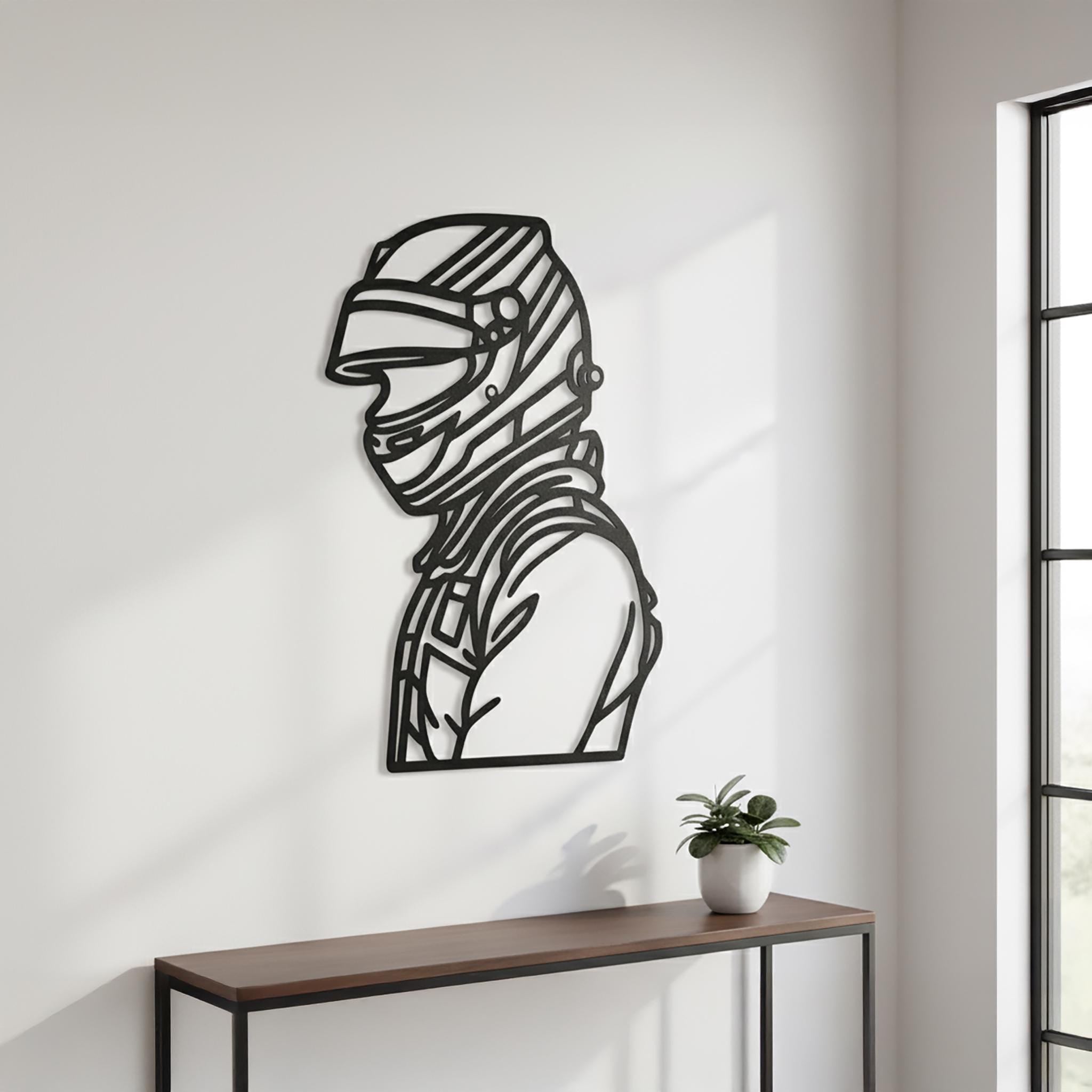 CNC metal wall art showing a racing driver helmet silhouette in a light grey home interior. Perfect motorsport fans gift and open-wheel home decor accent.