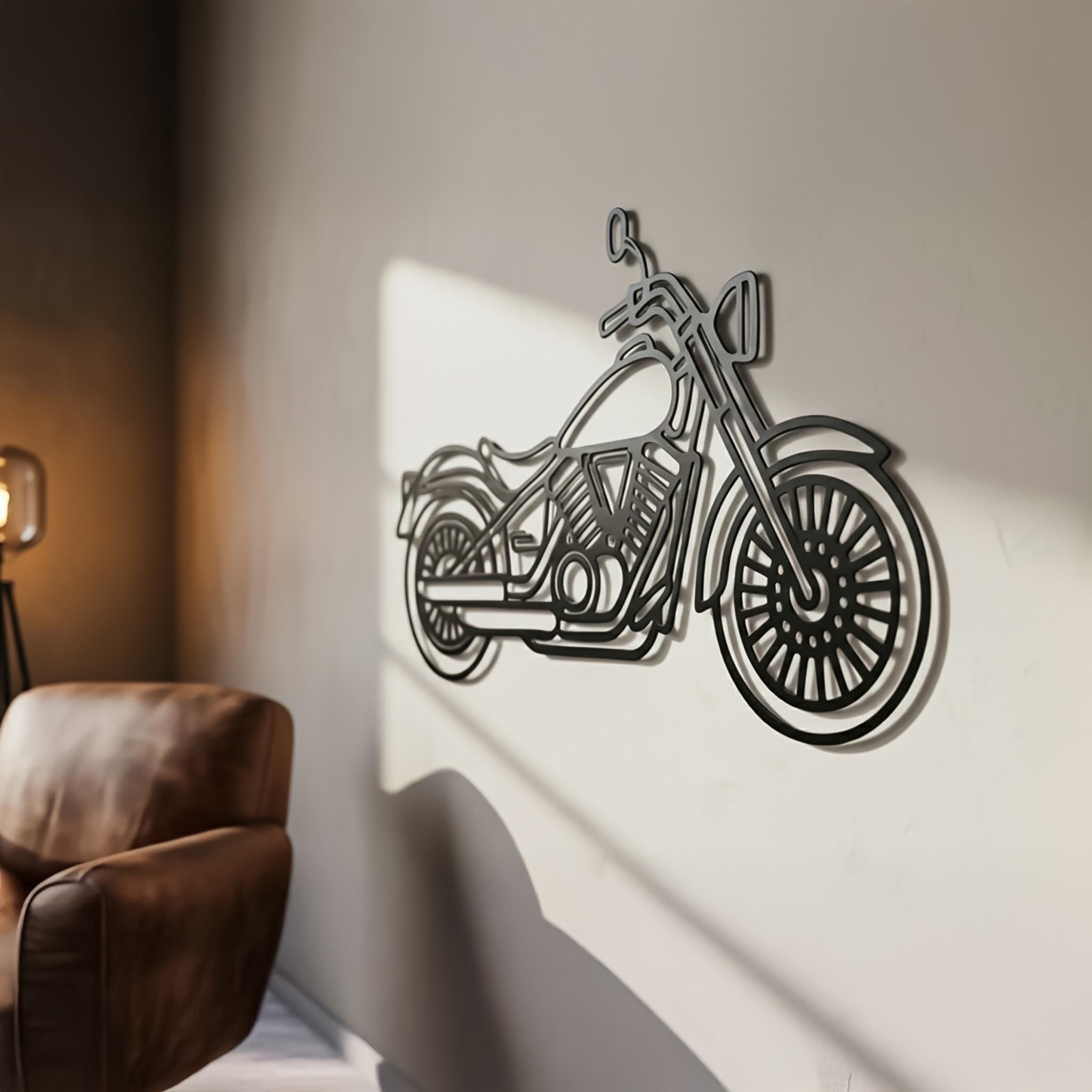Cruiser motorcycle metal wall art on warm-toned wall beside leather chair; sun streaks show 2 cm stand-off shadow; matte-black, powder-coated CNC lines; ideal for man cave, office, garage; optional personalized nameplate.