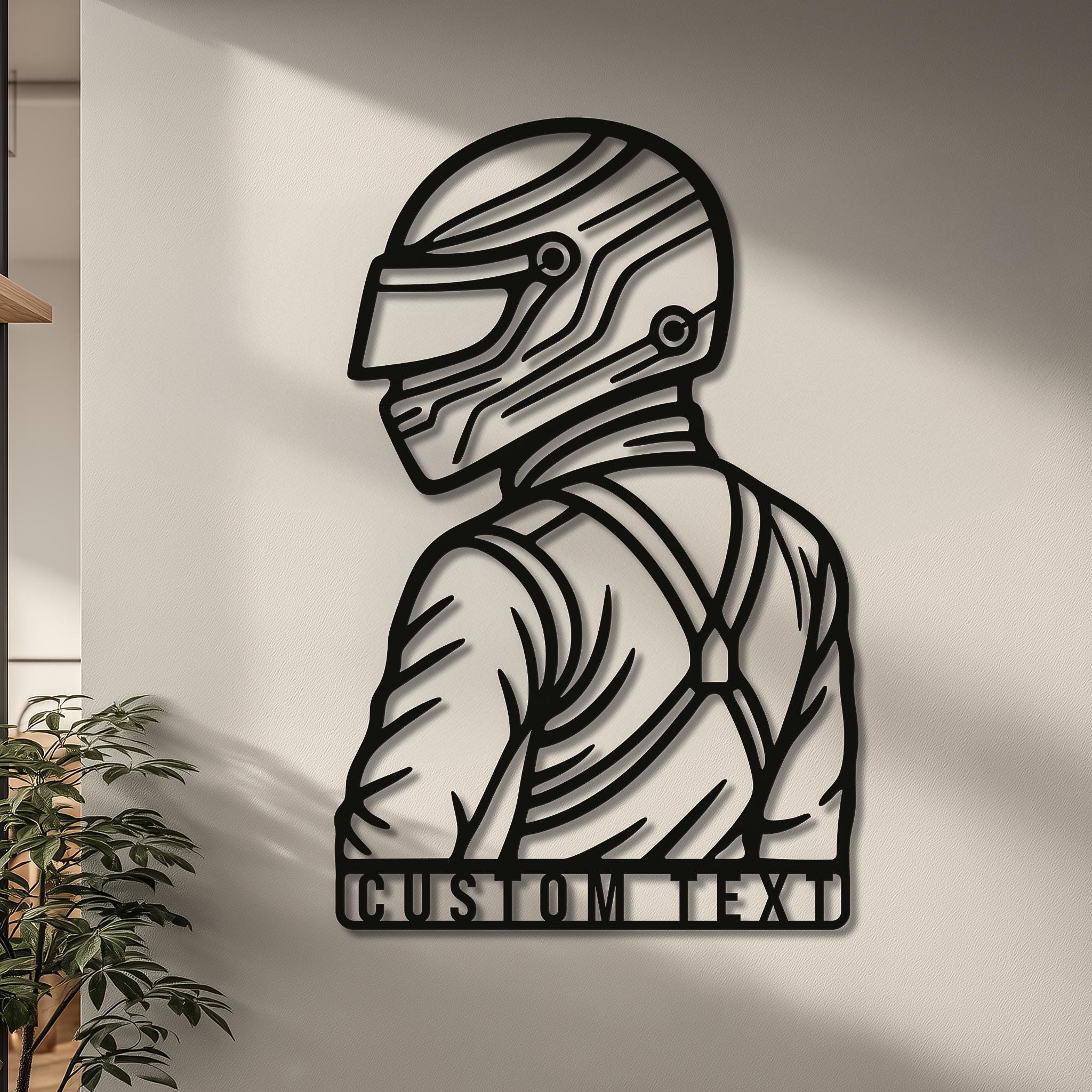 Personalized motorsports driver wall art with helmet silhouette; matte-black CNC metal and name/number bar for custom text; clean modern wall with diagonal sunlight; gift for racing enthusiasts; garage or game-room decor; multiple sizes; ready-to-hang premium finish.