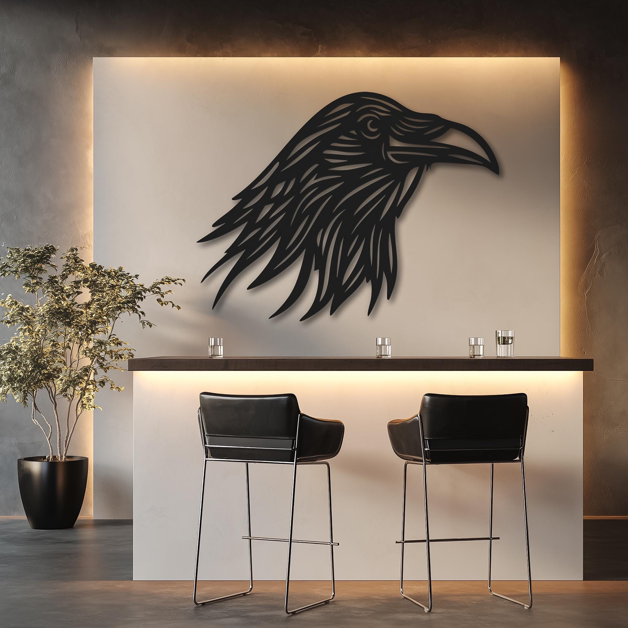 May include: A black metal wall art piece shaped like the head of a raven with intricate cut-out details. The silhouette features sharp, stylized feathers and a pointed beak, mounted on a textured, light-colored stone wall above a black console.