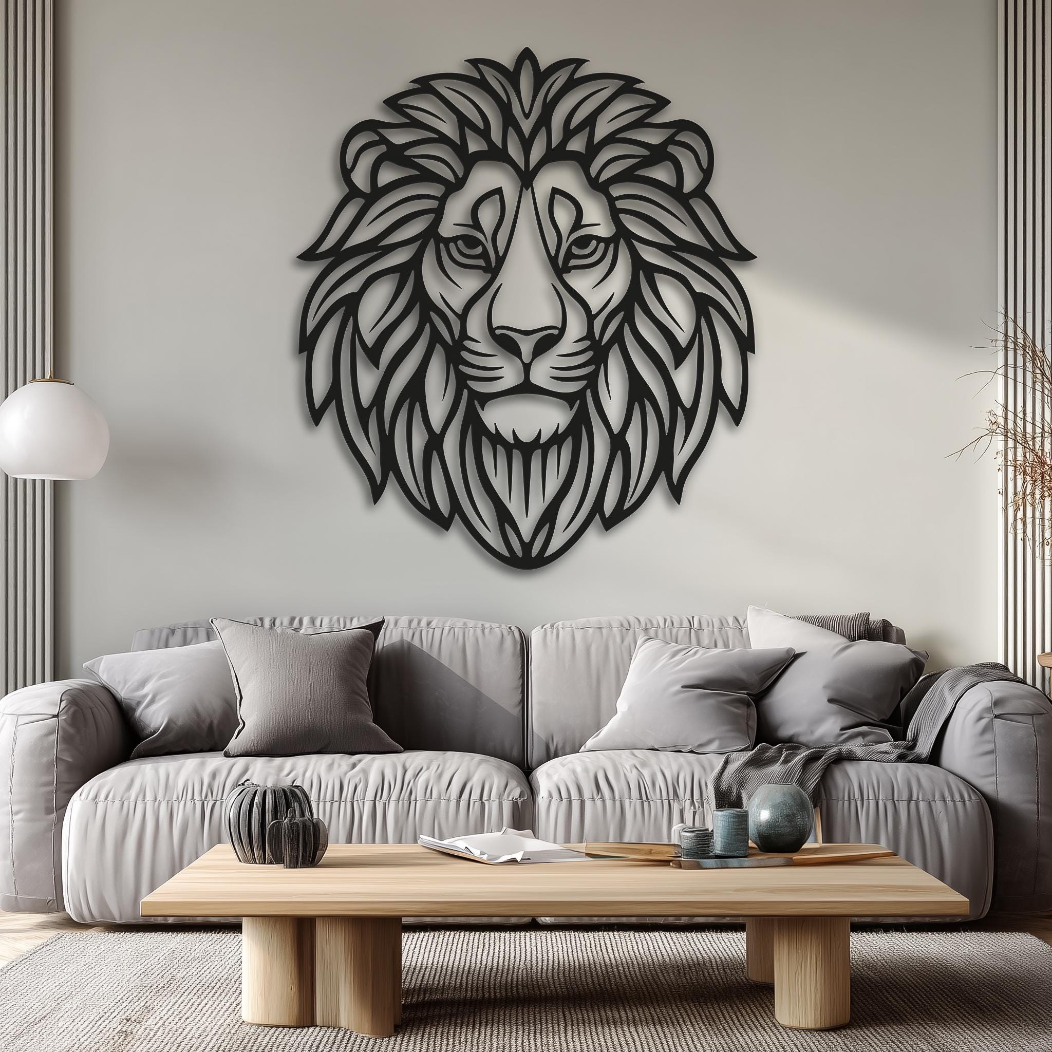 Oversized lion head metal sign on soft gray wall. CNC laser cut linework (2–6 mm look), matte black. Modern-minimal living room decor; works with rustic and contemporary styles; housewarming gift; safari inspired art.
