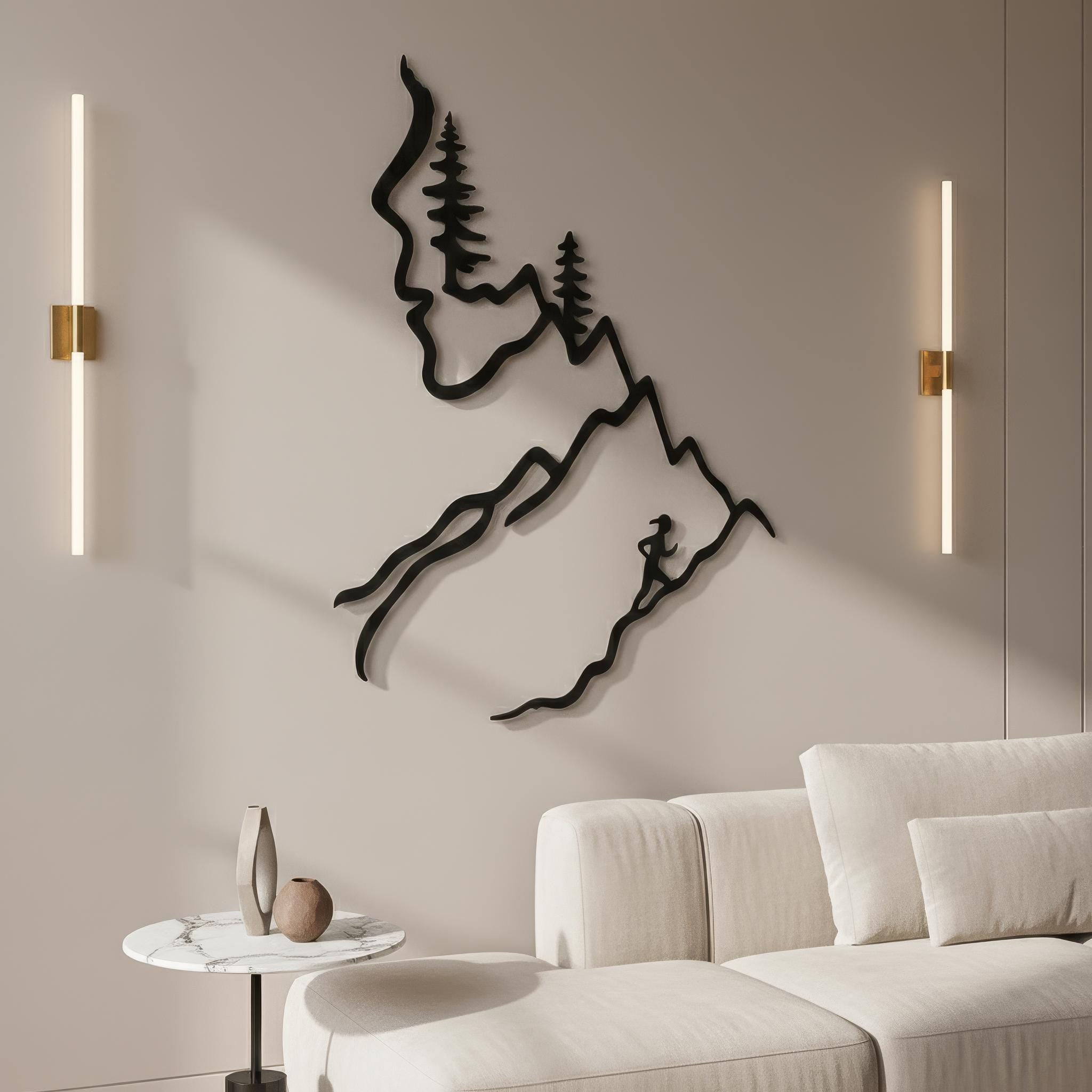 Statement metal mountain and female trail runner wall art between modern wall sconces, elegant sports wall art and trail running gift for her living room.