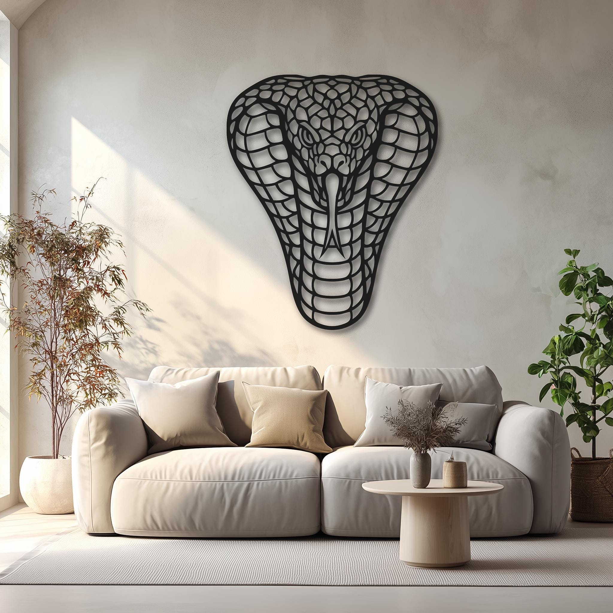 Cobra metal wall decor in a soft beige living room; natural light, plants, cozy premium styling; black powder-coated laser-cut steel; large wall sculpture for modern homes