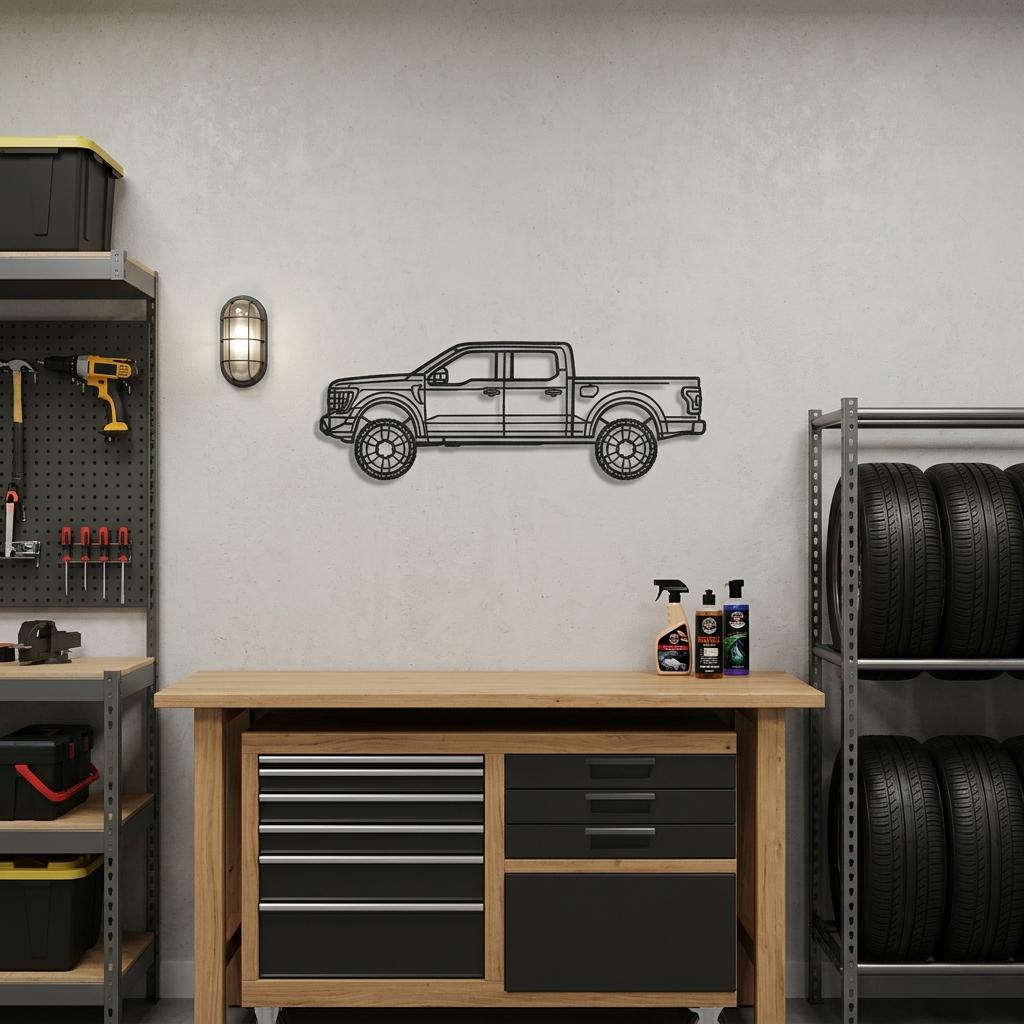 May include: A black metal wall art piece shaped like a pickup truck in profile. The design features a detailed outline of the vehicle, including the cab, truck bed, wheels, and windows, rendered in a flat, minimalist silhouette style.